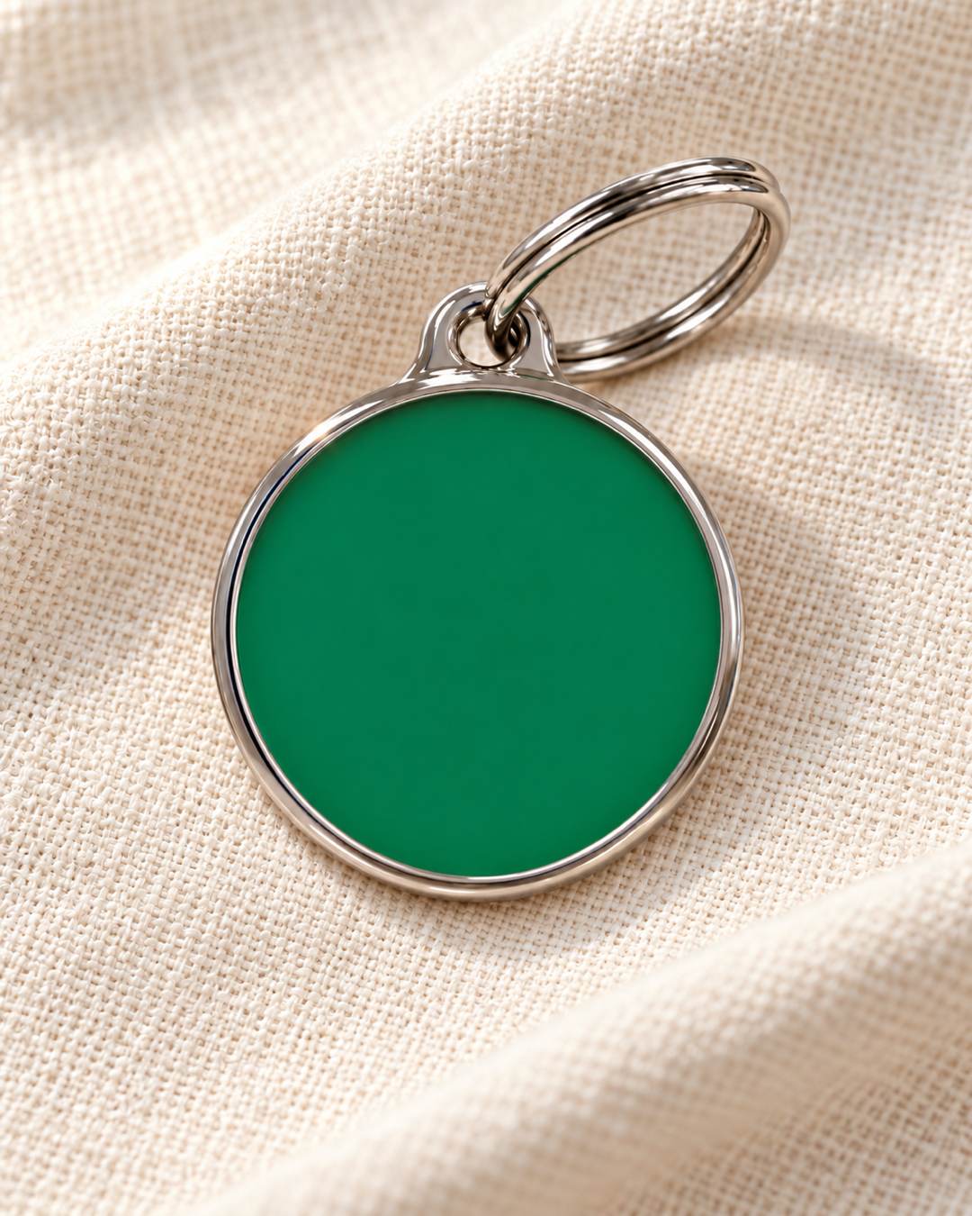 TAGiDOG Solid Round Green ID Tag dog ID tag on light linen
