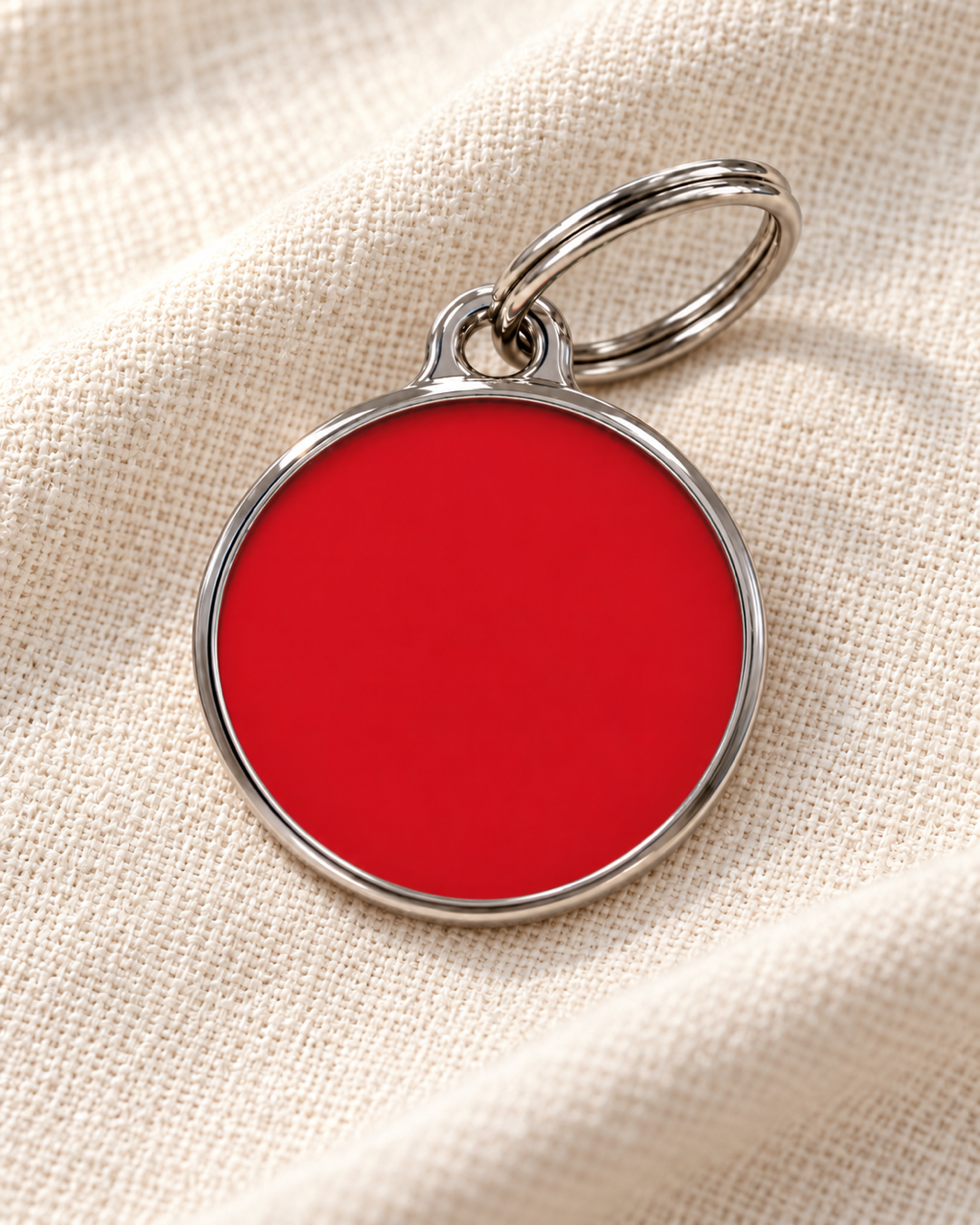 TAGiDOG Solid Round Red ID Tag dog ID tag on light linen