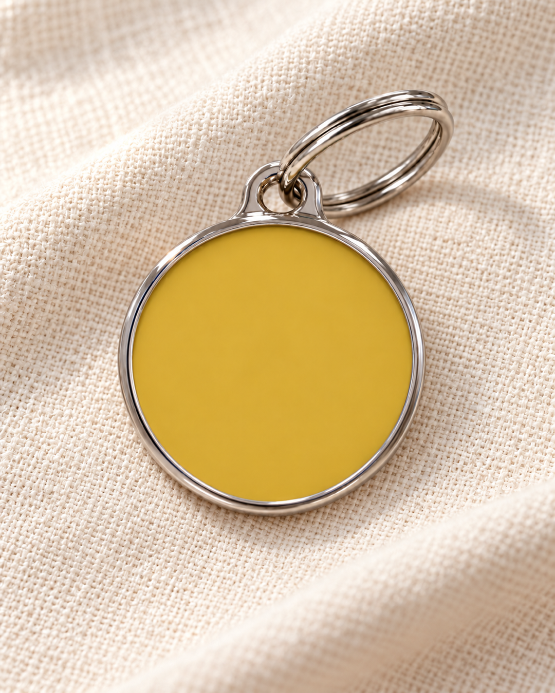 TAGiDOG Solid Round Yellow ID Tag dog ID tag on light linen