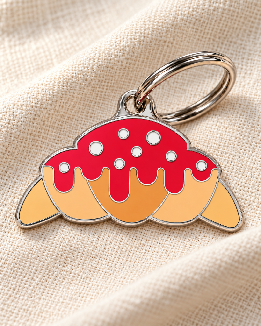 TAGiDOG Strawberry Glaze Croissant ID Tag dog ID tag on light linen