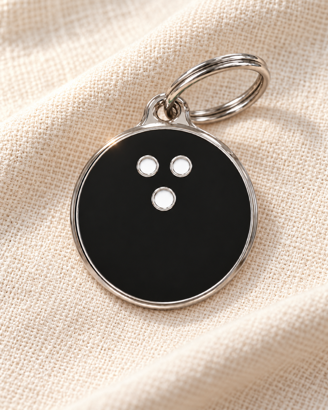 TAGiDOG Strike Black Bowling ID Tag dog ID tag on light linen