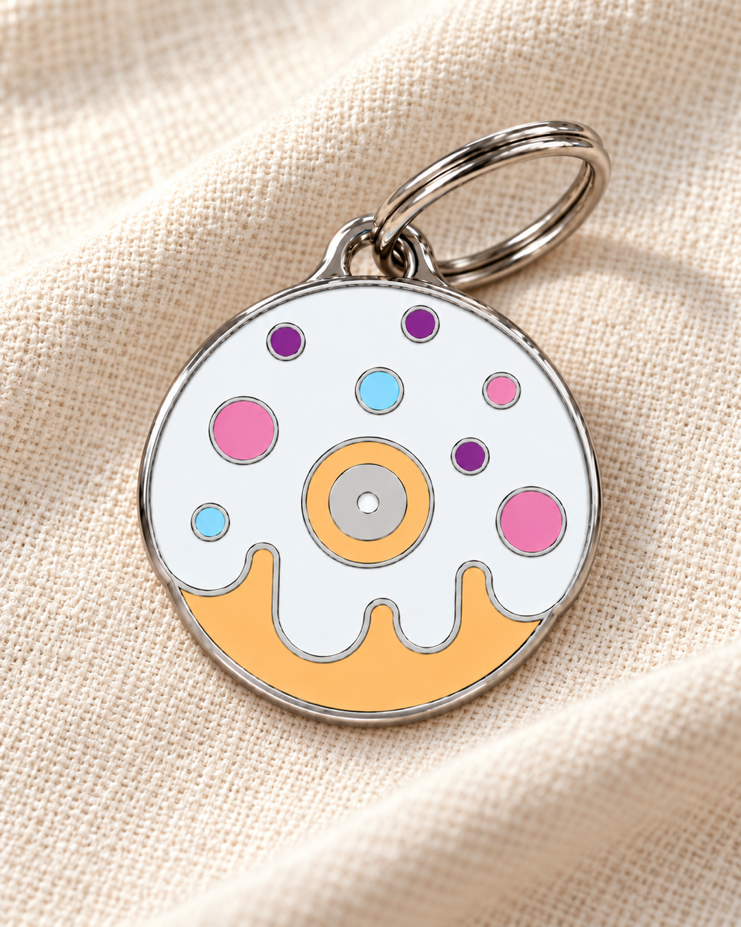 TAGiDOG Vanilla Donut ID Tag dog ID tag on light linen
